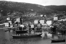 051: Two schooners in Red Island harbour. The one in front is Frank Ryan's fish storage boat the ""Anne and Agatha"". [courtesy of Marg (Ryan) Martin]